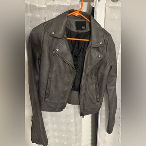 Small dark gray leather jacket bought at a boutique in Denver.